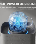 Automatic Desktop Cup Washer With 1.8L Tank Electric Glass Rinser spraying water on a clear cup to remove stains.