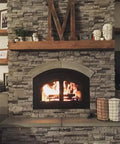 Cozy fireplace with a stone surround and wood beam mantel, featuring a blazing fire and decorative accessories.