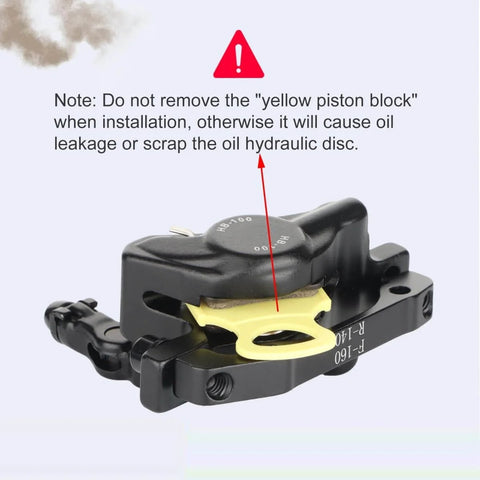 Close-up of HB-100 Hydraulic Disc Brake Caliper Kit with yellow piston block warning for smooth modulation and stopping power