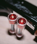 Close-up of shotgun snap caps 12 gauge with false primer reusable dry fire practice aids in metal holder