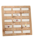 Straight Up The Coolest Wooden Ring Storage Tray With 15 Grids And Soft Velvet Lining To Keep Your Bling Organized On Vanity Or Dresser For Earrings And Bracelets displaying rings on a bamboo tray.