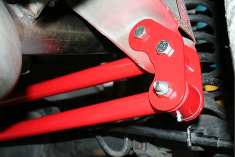 Panhard Bar Relocation Kit For 1982 2002 Camaro And Firebird Black Finish Street Ready Bolt On Upgrade Replaces Upper Support And Relocates Lower Bar To Make Room For Up To 3 Inch True Dual Exhaust Over Passenger Side Axle installed red steel bracket