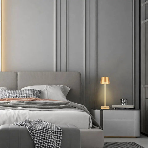 Cordless Table Lamp With Dimmable And Rechargeable Battery, Waterproof Gold Lampshade on a bedside table in modern bedroom