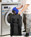 Person using Durable Nylon Laundry Backpack With Drawstring Closure near washing machine