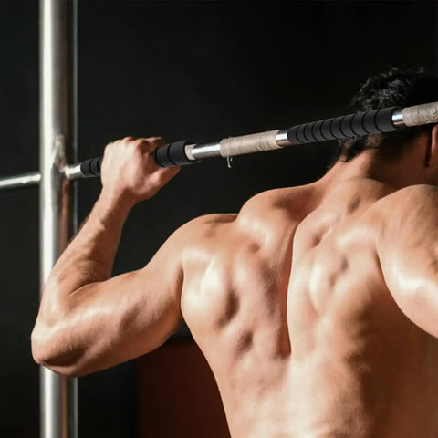 Man doing pull-ups using Three Pack Pull Up Bar Grip Sleeves With Anti Slip Sponge Pads for strength training at home or gym workouts.