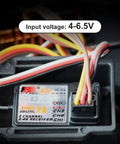 Close-up of Two Pack 3 Channel 2.4G AFHDS 2A Receiver showing input voltage of 4-6.5V with colorful wires attached.