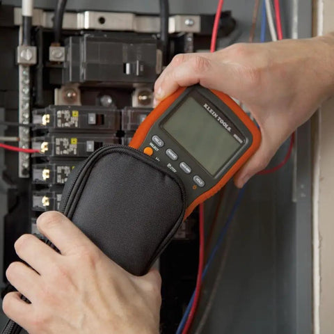 Person using Heavy Duty Multimeter Carrying Case With Rugged 600D Nylon Material And Secure PVC Zipper Built For Durable Meter And Tool Storage