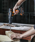 Heavy Duty Cordless Impact Drill Equipped With Killer Dual Speed Motor And 18 Precision Torque Settings For No Sweat Home Repairs And Rock Solid Construction Power in use on wood.