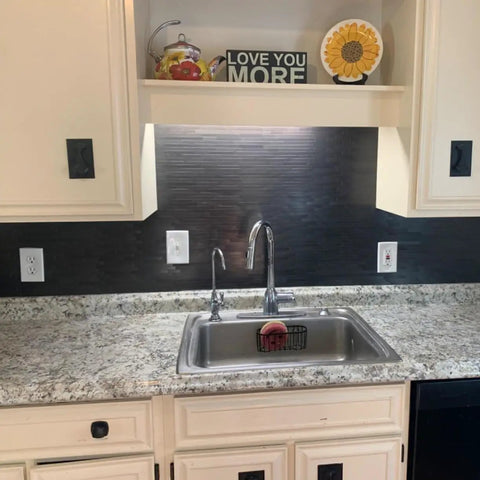 Kitchen sink area with self adhesive brushed aluminum backsplash tiles for kitchen and fireplace peel and stick 4mm thick.