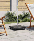 Rock Solid Parasol Base In Black Granite With Stainless Steel Construction Square Design on patio with chairs