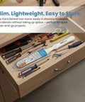 Paint Behind Toilet Tool Kit With 12-Inch Reach Flat Brush stored in a wooden drawer among tools like screwdrivers and wrenches