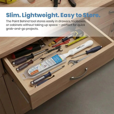 Paint Behind Toilet Tool Kit With 12-Inch Reach Flat Brush stored in a wooden drawer among tools like screwdrivers and wrenches