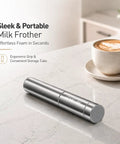 Portable Milk Frother Handheld Battery Operated Travel Coffee Frother With 2 Stainless Steel Whisks For Creamy Foam In Seconds Ideal For Lattes Cappuccinos Hot Chocolate And More Batteries Included Silver on countertop beside cup of coffee