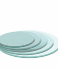 Stack of clear 32 Inch Round Tempered Glass Lazy Susan Turntable plates with beveled edges for dining and home office use.