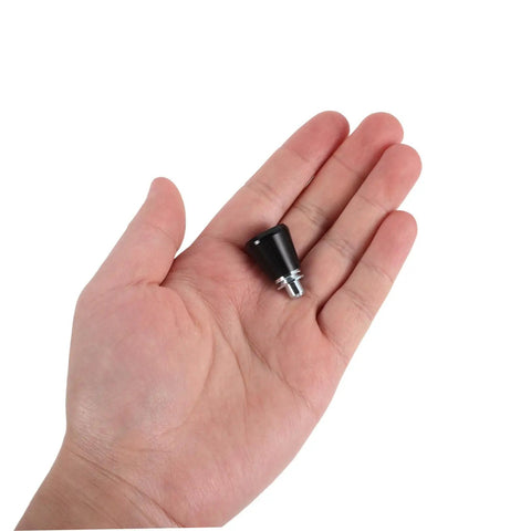Retractable Spring Locating Pins Set Of 4 With Black Reset Spring shown in palm for scale