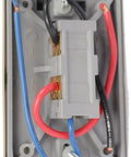 Back view of T651A3018 Heat And Cool Thermostat For 120V To 277V Systems showing wiring connections and durable casing.
