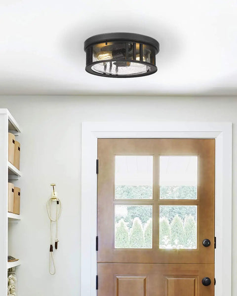 Industrial Two Light Flush Mount Ceiling Light With Black Cage Frame And Seeded Glass Shade, 13 Inch Fixture in an entryway