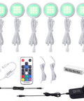 Rgb Color Changing Led Under Cabinet Lights Kit With Wireless Remote Dimmable Six Puck Lamps For Kitchen Cabinets Wardrobe Furniture Ambiance And Christmas Decor Built For Quick Install And Dope Mood Lighting, showing six green LED puck lamps, remote, and accessories