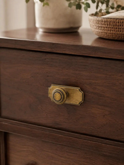 Top Shelf Antique Brass Cabinet Knobs With Killer Scalloped Backplates And Hella Durable Build For Fresh Kitchen And Bathroom Renovations Two Point Seven Five Inch Width Six Pack shown on wooden drawer.