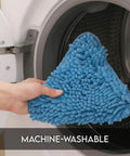 Premium Steam Pocket Replacement Mop Pads In Bright Coral For Steamboy H2O X5 S302 Machines, blue microfiber pad being loaded into washing machine.