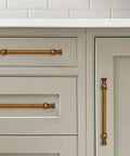 Antique brass cabinet pulls installed on kitchen cabinets, part of 2 Pack 8 Inch Center Antique Brass Cabinet Pulls Heavy Duty Solid Zinc Alloy Handles