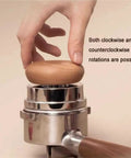 Top Shelf 58mm Espresso Tamper And Coffee Distributor Leveler Set featuring a hand holding a wooden tamper on a portafilter.