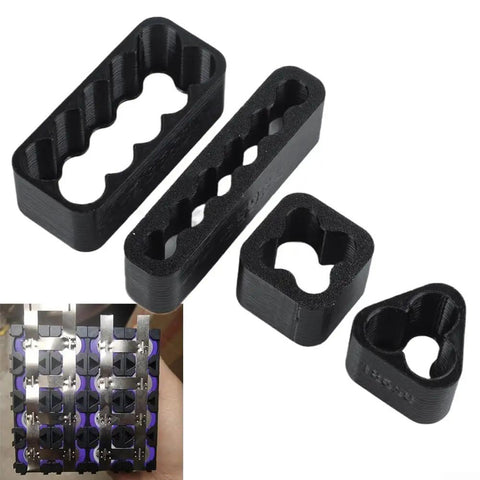 Hella Solid Welding Fixture Set With Precision Assembly Brackets For Diy And Pro Spot Welding Lithium Battery Pack Project Jigs And Multi Angle Clamps Tool Kit showing four black plastic brackets for precise lithium battery setups.