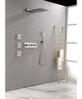 Wall Mounted Waterfall Rain Shower System with 3 Body Sprays & Handheld Shower against a gray wall with a yellow ladder.