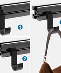 2020 Series Mini Hanging Hooks For European Standard Aluminum Extrusion holding a brown bag on black linear rail.