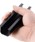 Hand holding black aluminum rail for Beefy 4 Panel Side By Side Roof Mount Kit For Shingle Or Metal Roof With Hardware Heavy Duty Aluminum Rails