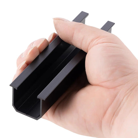 Hand holding black aluminum rail for Beefy 4 Panel Side By Side Roof Mount Kit For Shingle Or Metal Roof With Hardware Heavy Duty Aluminum Rails