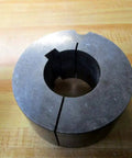 Metal Dodge Taper-Lock Bushing 117116 with 1-7/8 bore, 1/2 inch keyway, on wooden surface for power transmission equipment.