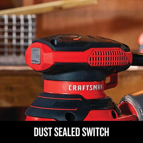 Close-up of a Beast 5 Inch Orbital Sander with 12000 OPM, featuring dust sealed switch on red and black hand tool.