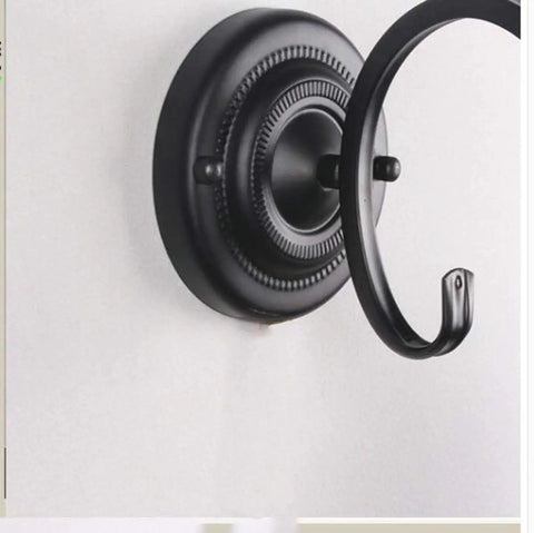 Close-up of Plug In Wall Sconce Lamp With E27 Base Metal Glass Shade showing black round metal mounting plate detail.