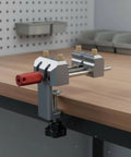 Premium Blue Aluminum Bench Vise With Sliding Screw And Brass Jaws For CNC Machining, Home Workshop Clamping, And Precise Mini Table Tool Work on wooden table.