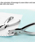 One Handed Hole Punch For Paper, 6 Sheet Capacity, 3.175mm Hole, Chrome Plated Handheld Puncher on paper, shown close-up