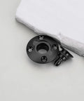 RC Airplane Fuel Tank Plug Cap, CNC Aluminum Alloy Anodized Black Round Oil Filler, top view near white foam block