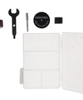 Dremel tool accessories including cutting disc, sanding drum, wrench, and storage case for Certified Renewed 12 Volt Cordless Rotary Tool Kit.