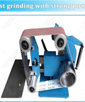 Built Tough Dual Position Bench Belt Sander And Electric Polisher With Smooth Variable Speed Control Up To 5000 RPM And Five Heavy Duty Belts For Quick Sharpening Tasks, showing blue metal construction with sanding belt.