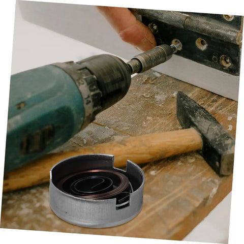 Built Tough Drill Press Quill Feed Return Spring And Replacement Coil Kit Heavy Duty Steel 2.04 By 1.75 Inches on workbench with tools.
