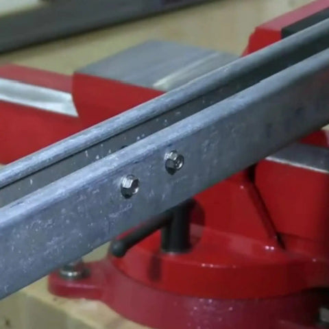Top Sh*...* - close-up of #8 hex washer head self-tapping steel screws installed on a metal panel.