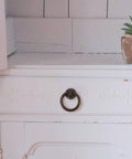 Two Pack Vintage Drop Ring Drawer Pulls In Antique Bronze For Dresser Cabinets And Doors Retro Cabinet Knobs And Handles installed on white drawer