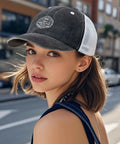 Person wearing All Day Comfort Unisex Adjustable Trucker Cap With Breathable Mesh in an urban setting, side profile view.