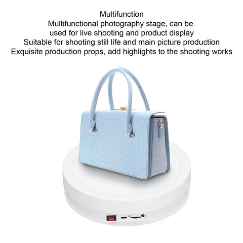 Check Out This Sick Electric Rotating Display Stand With Remote Control For Smooth 360 Degree Videos, Adjustable Speeds, USB Power, And Colorful LED Lights Perfect For Pro Product Photography Sessions, showcasing a blue handbag.