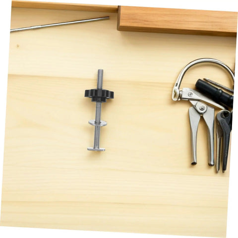 4 Piece T Slot Bolts And Star Handle Knobs With Flat Washers For Woodworking Jig Hardware adjustable T Track clamping system laid on wood.