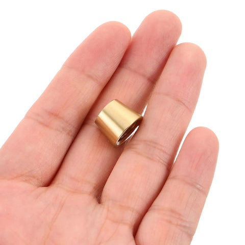 Brass Furniture Stabilizer Legs Four Pack For Mini Cabinets And Desks 10mm Decorative Riser Feet in hand close-up