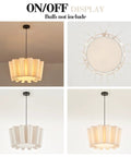 Modern pendant light with translucent shade displaying warm glow, shown in on/off states; bulb not included.