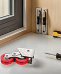 Built Tough Double Wheel Sliding Glass Door Rollers Designed For Slick Operation And Zero Friction Glide Crafted From Heavy Gauge Stainless Steel For Rock Solid Track Hardware Kits Of Two on work table with tools.