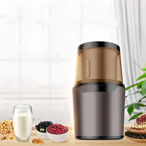 No Brainer Portable Bean To Cup Coffee Grinder And Spice Mill With Tap Control Quick Crushing Action Stainless Steel Bin displayed with ingredients.