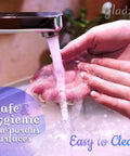 Glass Cuticle Pusher Manicure Stick With Slanted Side And Pointed End Being Washed Under Running Water